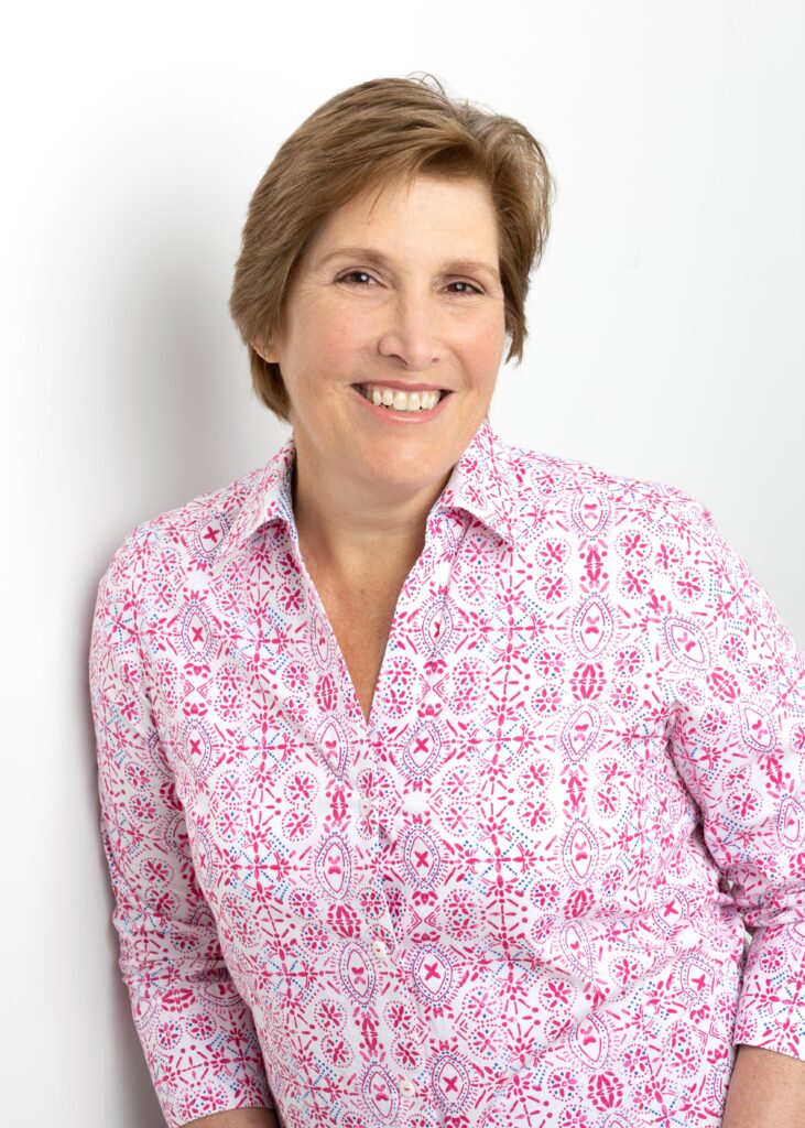 Headshot of professional woman wearing pink shirt