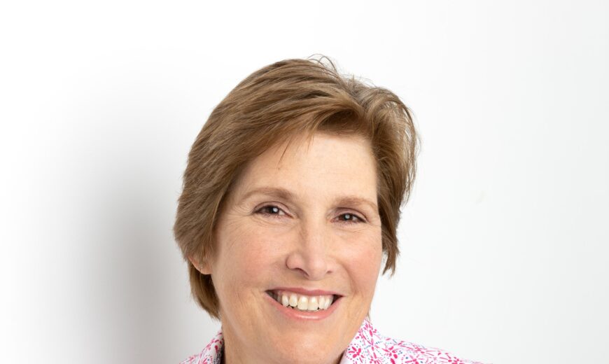 Headshot of professional woman wearing pink shirt